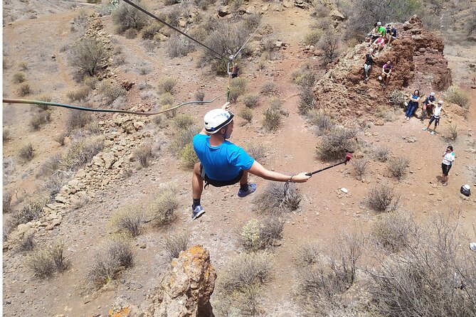 Climbing + Zipline + Via Ferrata + Cave. Adventure route in Gran Canaria - The 50-Meter Zipline Finish: Quick Adrenaline Payoff